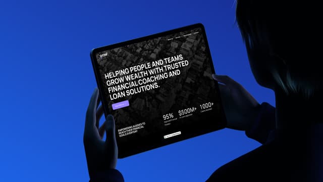 A silhouette holds a tablet displaying the Grow financial coaching and loan website homepage against a blue background.