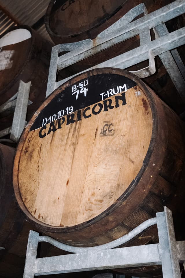 A Capricorn Distilling Co barrel head stencilled with the brand mark