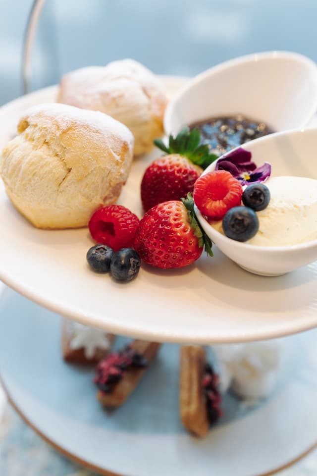 A tiered stand of scones, strawberries, raspberries, blueberries and cream at Hilton Surfers Paradise.
