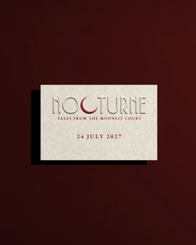 The Nocturne invitation card, blind embossed on bone stock with the crescent in accent red.