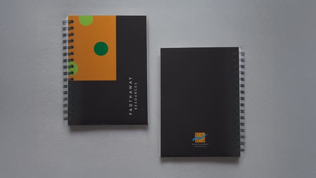Padthaway notebooks in Shadow Grey, with the mark and seed dots blocked in on the cover.
