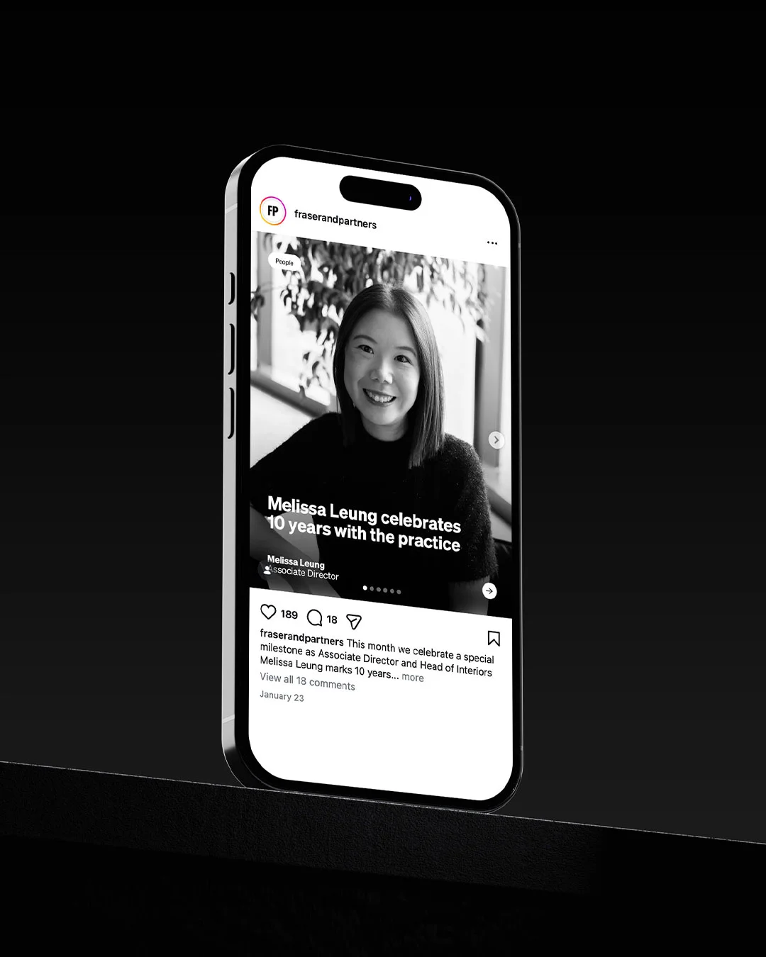 Phone mockup on a dark backdrop showing a branded Instagram post with comments and engagement metrics.