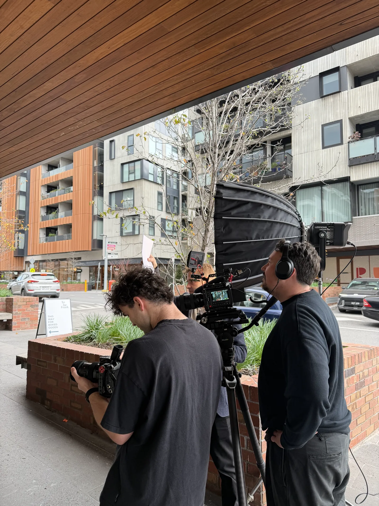 Lucky Boy crew filming at street level outside East Brunswick Village