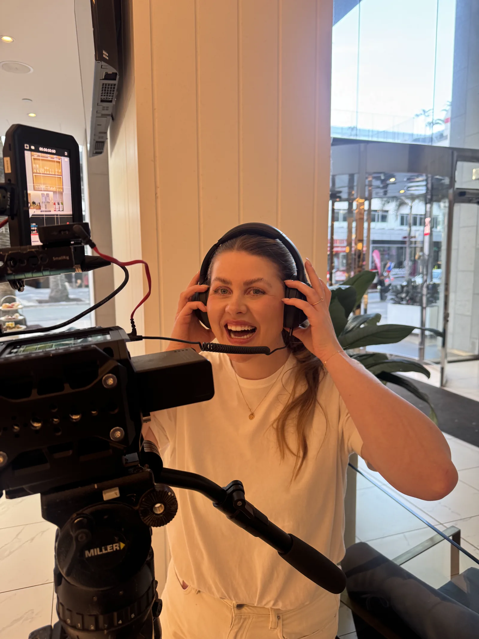Lucky Boy videographer monitoring an interview take behind the camera at Hilton Surfers Paradise