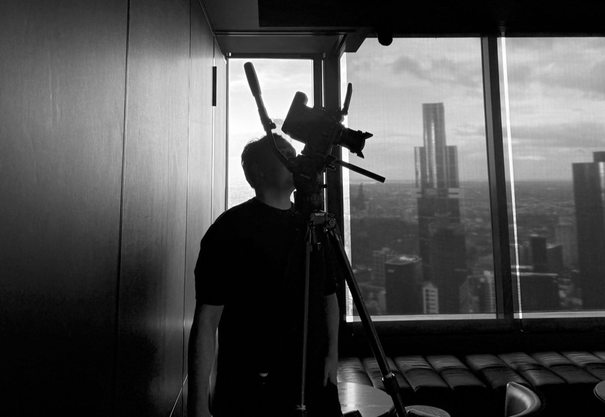 Lucky Boy Agency video production crew on set in Melbourne with a cinema camera and lighting kit.
