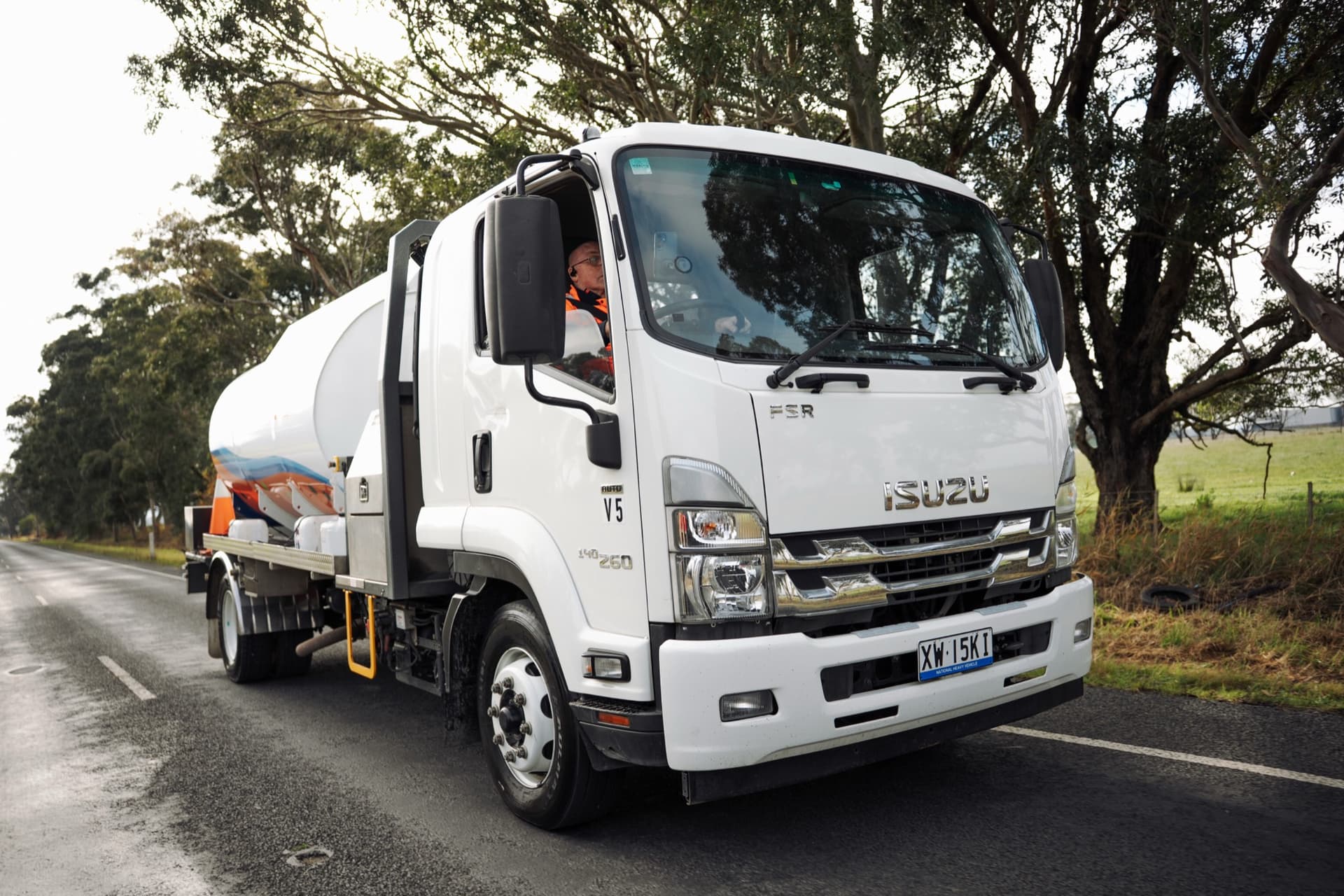 A Padthaway Resources tanker driving a country road under trees.