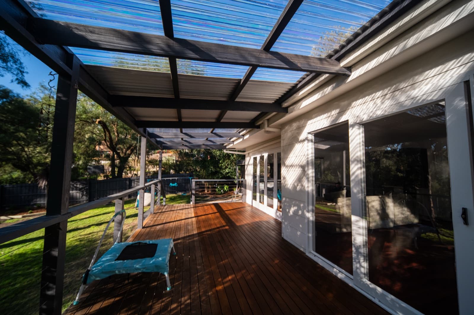 The finished deck and pergola at the back of the renovated house