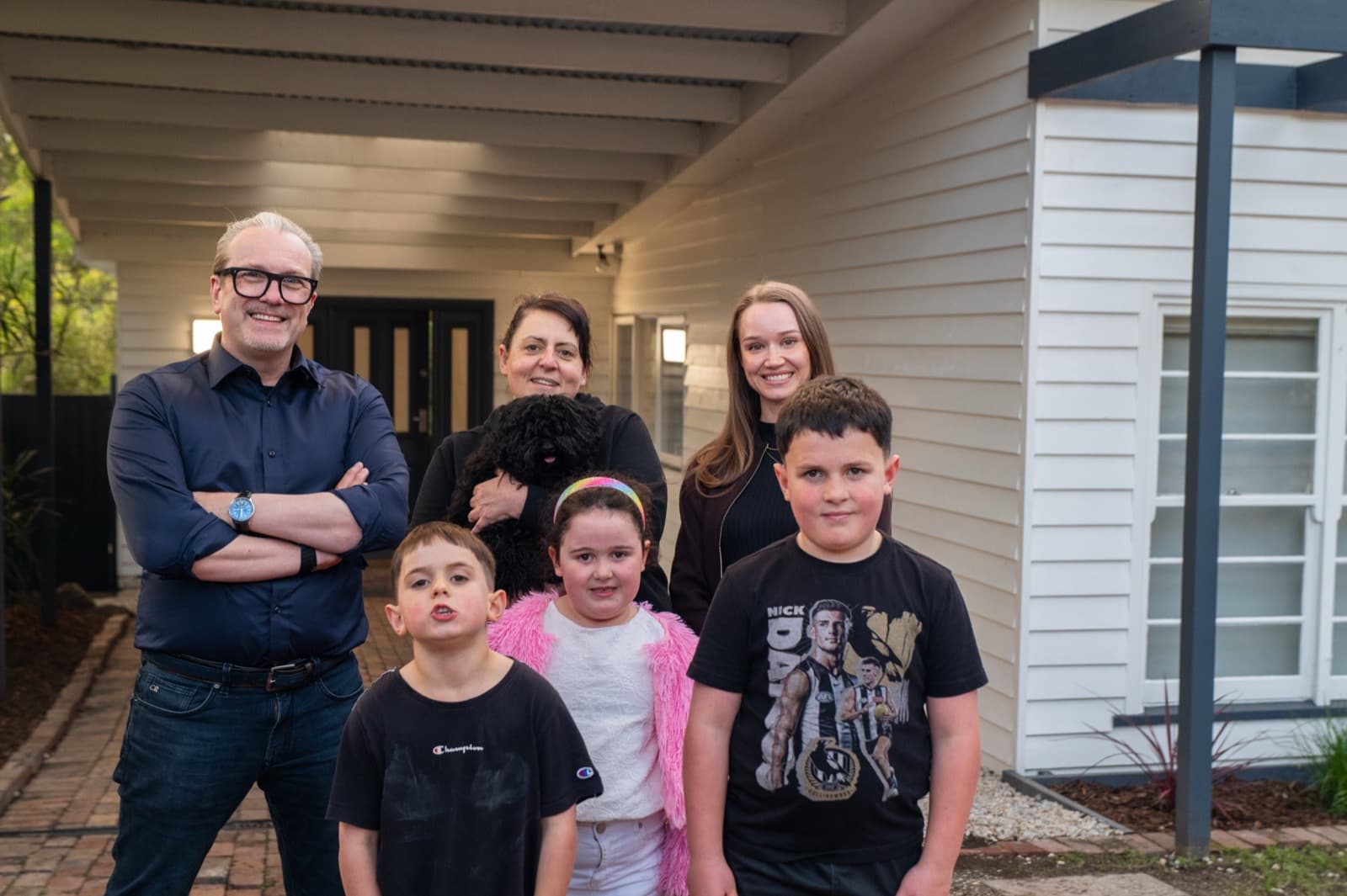 Angelina and her children with St Ferrer director Chris Bertacco outside the renovated home
